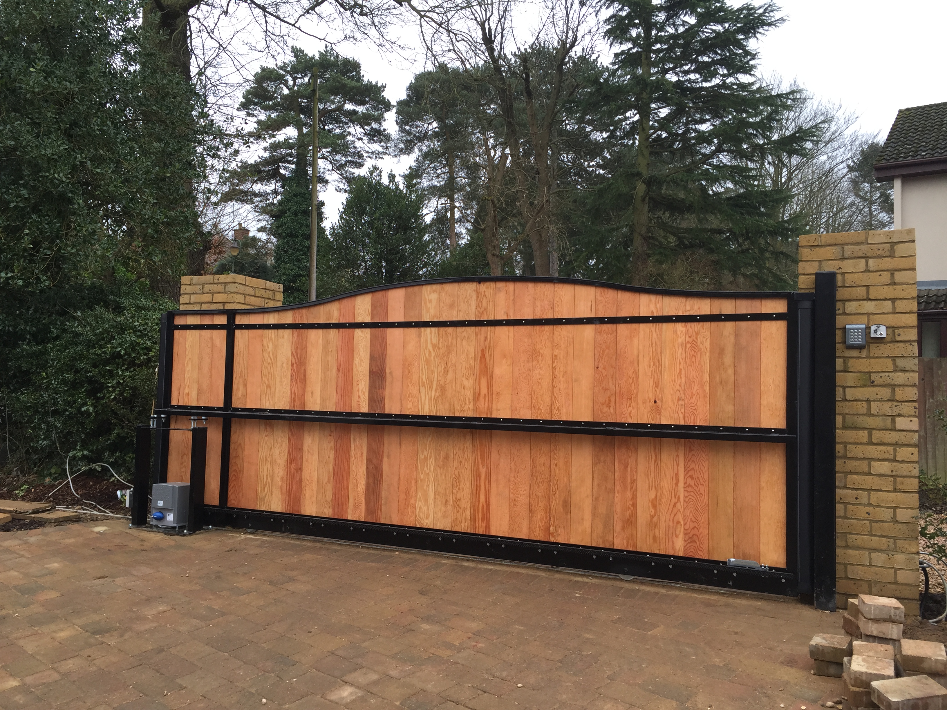 Steel frame tracked sliding gate with T+G infill rear