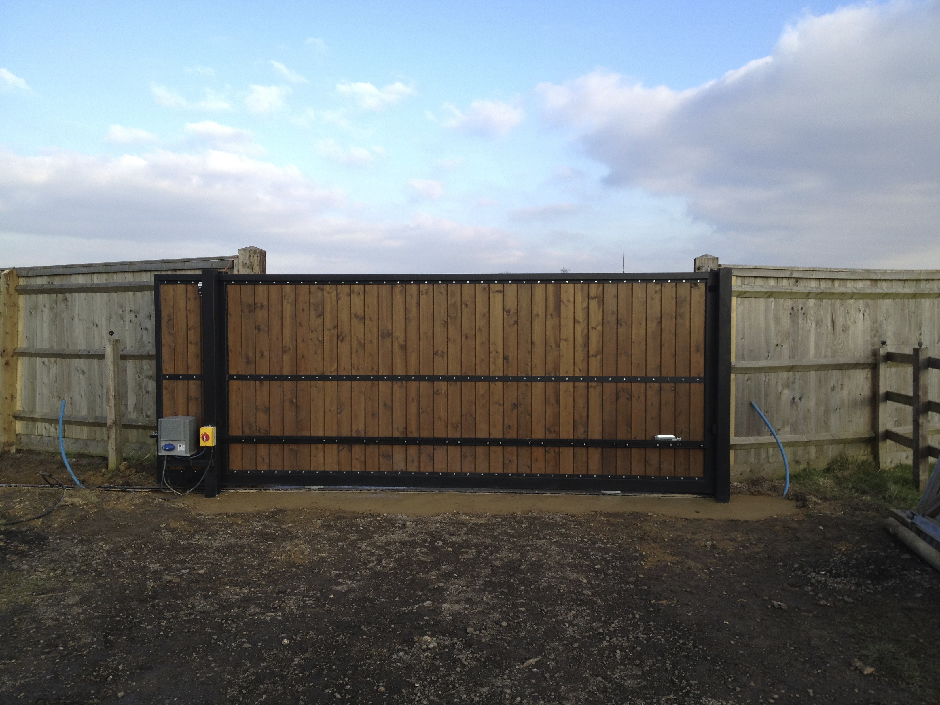 Steel Frame sliding gate with  tongs and groove infill, Pre automated prior to deliver to site installed and closed